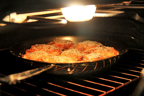 Finally, add a generous layer of freshly grated parmigiano-reggiano cheese to the crispy chicken skin, and place under your oven's broiler for about 3-5min until the cheese becomes golden brown and delicious.