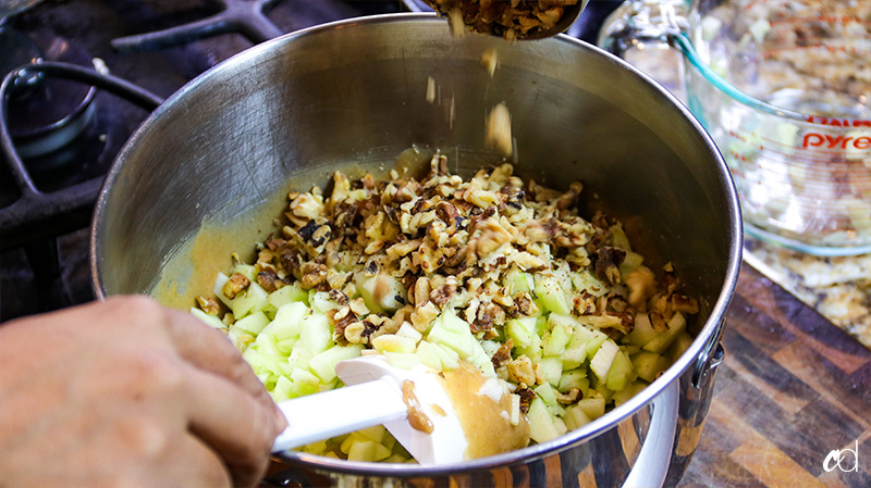 pour the walnuts and apples into the batter