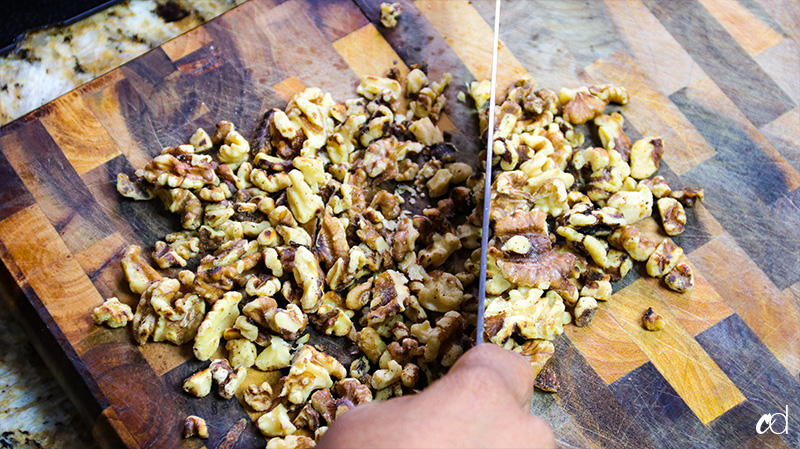 chopping toasted walnuts