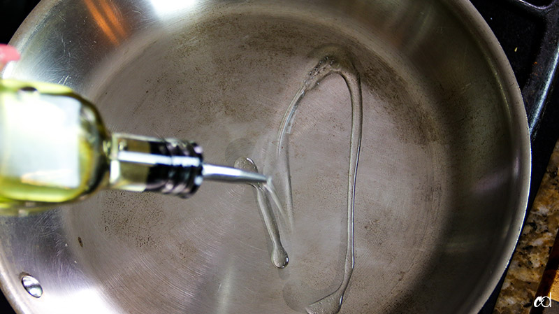 pouring oil skillet