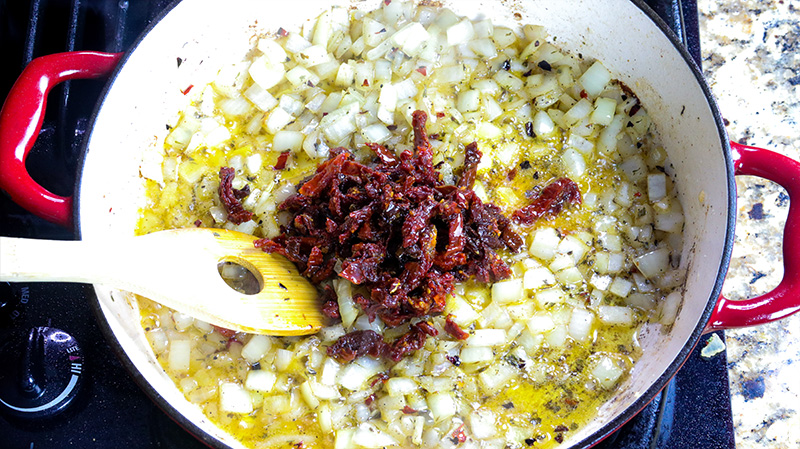 sun-dried tomatoes added to onions