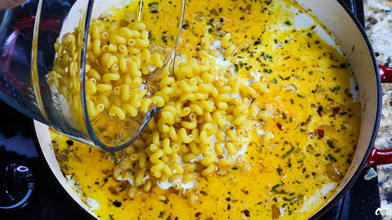 cavatappi pasta added to sauce