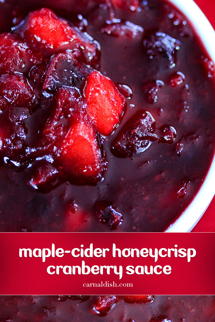 Intensely flavored homemade cranberry sauce infused with star anise, orange marmalade, pure maple syrup, and studded with juicy pieces of honey crisp apples. You'll never want canned cranberry sauce ever again | #carnaldish #cranberrysauce #orangecranberrysauce #thanksgivingsides #thanksgiving