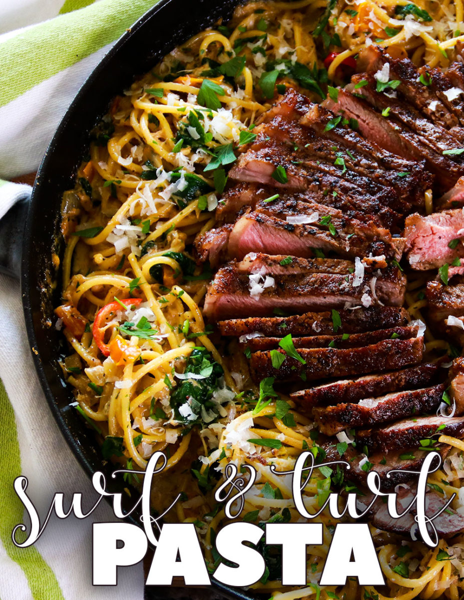 Spicy Surf and Turf Pasta featuring juicy seared steaks in herb and garlic brown butter, thinly sliced on top of creamy, yet spicy crab spaghetti. It\'s truly the best of both worlds. #surfandturfpasta #surfandturf #steakpasta #crabpasta #seafoodpasta #steakhousepasta #pastarecipes #spaghettirecipes #quarantinecooking #carnaldish #nystripsteaks #dryagedsteaks #steakrecipes #recipes #cooking
